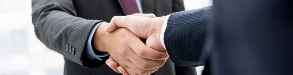 Image of two business men shaking hands - Sales, Mergers and Acquisitions page