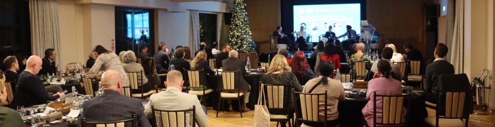 Photo of attendees watching Sustainable Leadership panel.